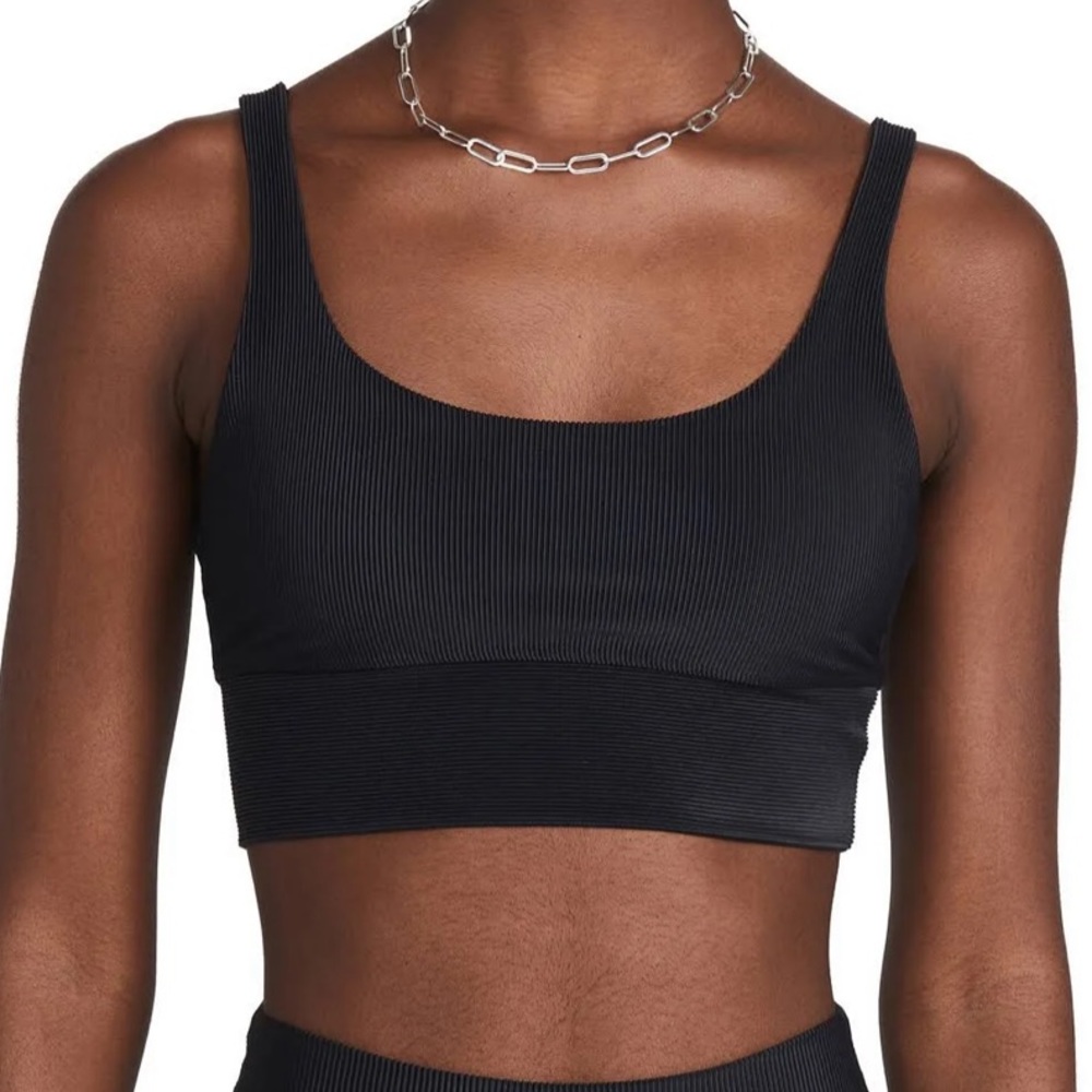 Beach Riot "Leah" sports bra, black ribbed material.